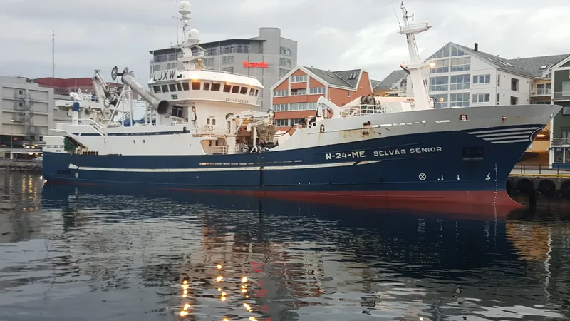 Fishing vessel alongside the quay in a Norwegian fishing port